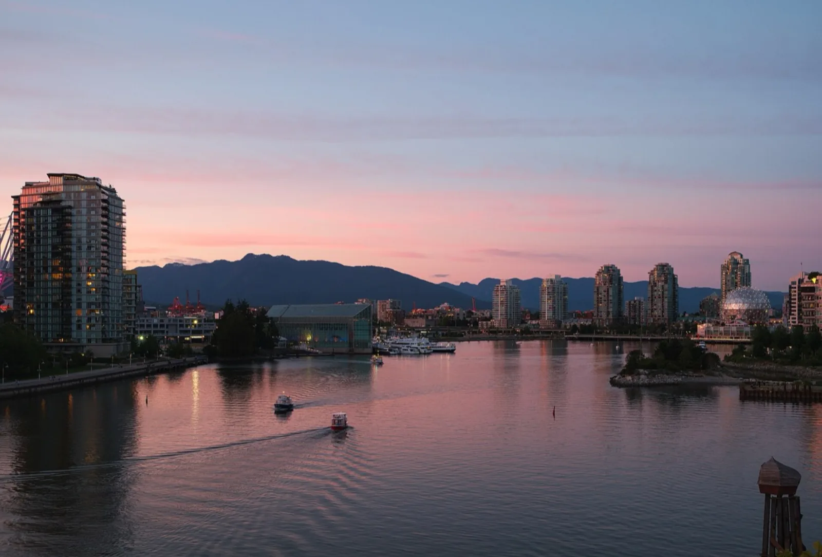 Townhouses and mid-rise housing at False Creek at dusk