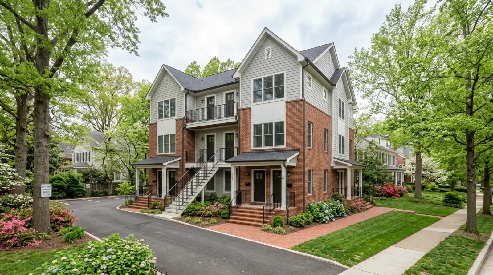 A newly built six-unit house-scale building on a tree-lined Arlington, Virginia street, the kind of home the EHO rule allows